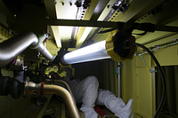 A LinkEx™ LX-400 LED Temporary Luminaire illuminates the interior of a Boeing 737 fuel tank