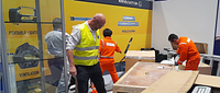 Miles Jackson of Wolf Safety helping to dismantle an exhibition stand