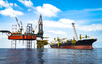 A Floating Production Storage and Offloading (FPSO) vessel alongside an offshore oil platform.
